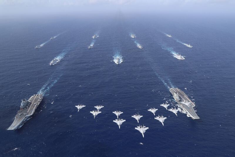 Chinese aircraft carriers Liaoning and Shandong carry out a dual aircraft carrier formation exercise for the first time in the South China Sea in October 2024.