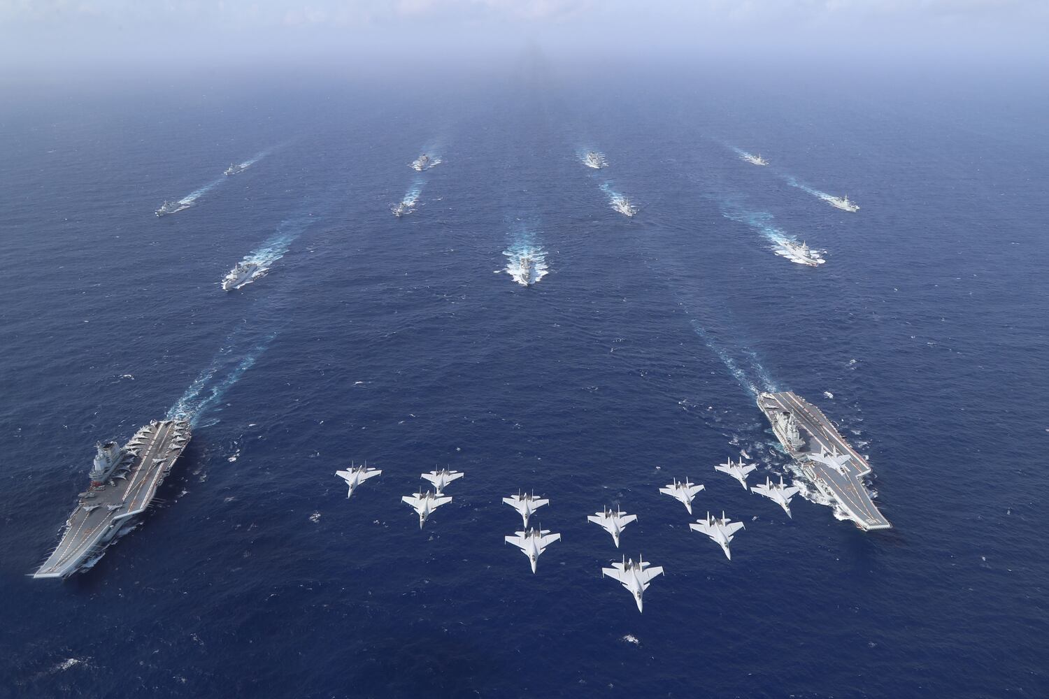 Chinese aircraft carriers Liaoning and Shandong carry out a dual aircraft carrier formation exercise for the first time in the South China Sea in October 2024.