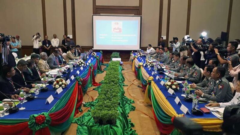 Delegates from Border Guards Bangladesh discuss border-related issues with officials from the Myanmar Police Force during a meeting in Myanmar's capital Naypyidaw, April 8, 2019.