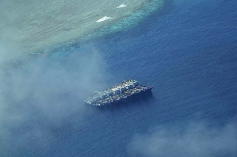 Suspected Chinese maritime militia boats are seen anchored off a disputed shoal in the Spratly Islands in the South China Sea, Feb. 21, 2023. Credit: National Task Force for the West Philippine Sea handout/AFP
