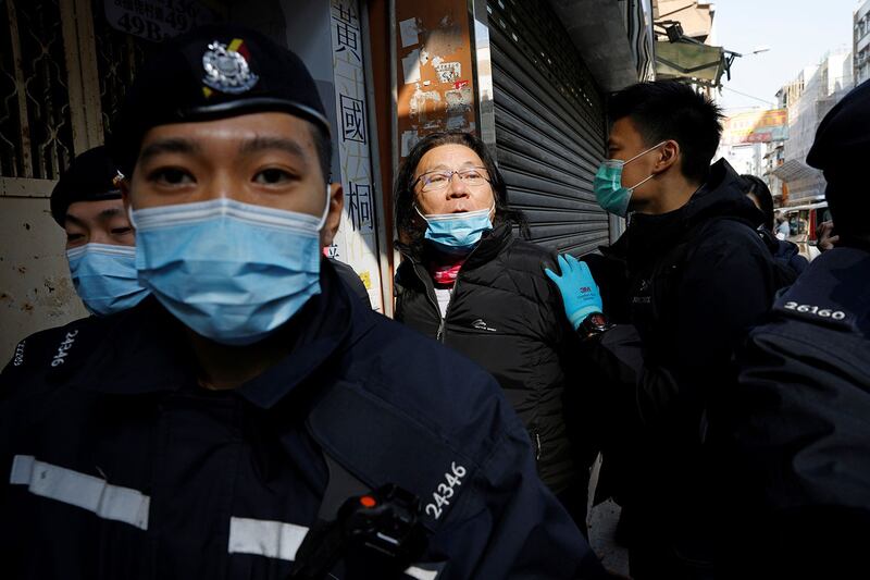 2021年1月14日,香港九龙城区议员黄国桐被警方逮捕。(路透社)