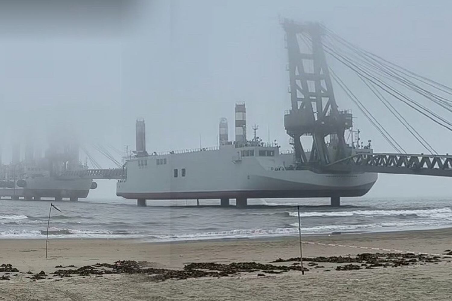 An undated image circulated on China’s social media showing a line-up of special barges at a beach.
