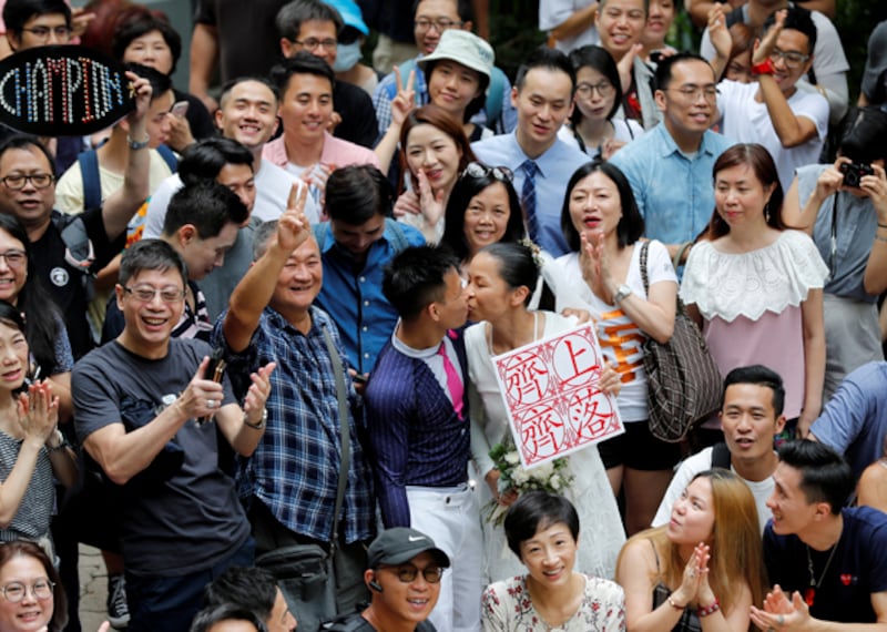 湯氏夫婦由案發仍是情侶,經歷風雨走到今天已結成夫妻。(路透社)