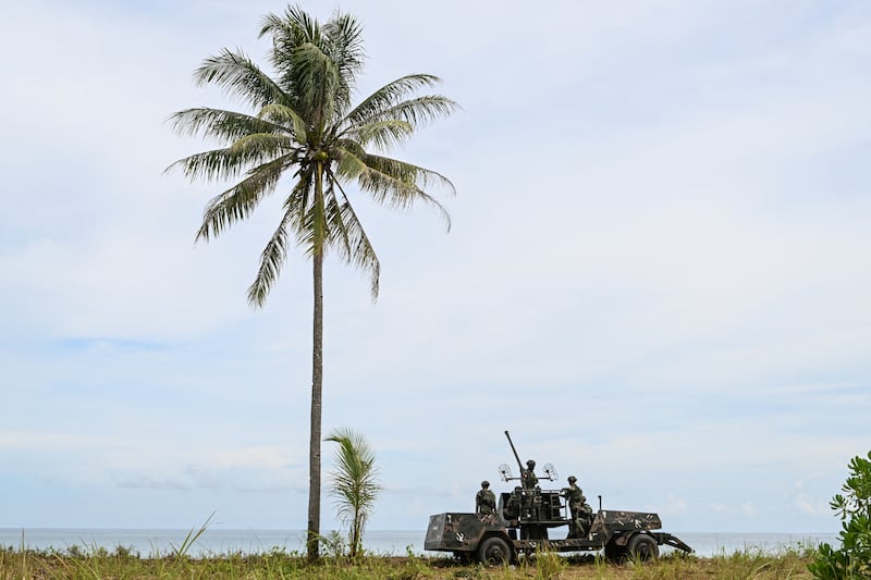 Philippine military personnel sit on a military vehicle as they take part in a counter-landing live fire exercise during the annual US-Philippines joint military "Balikatan" exercise in Rizal, Palawan, Philippines, April 28, 2025.