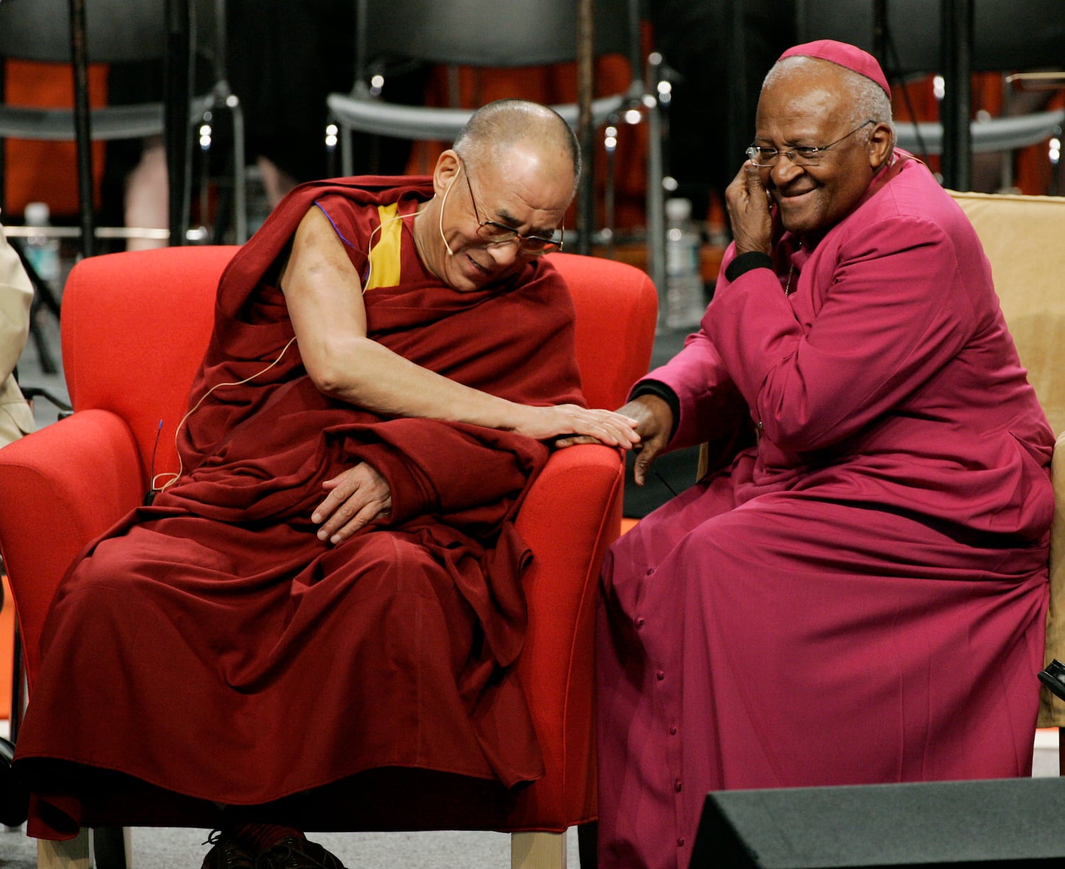 The Dalai Lama speaks with Archbishop Desmond Tutu in Seattle, April 15, 2008.