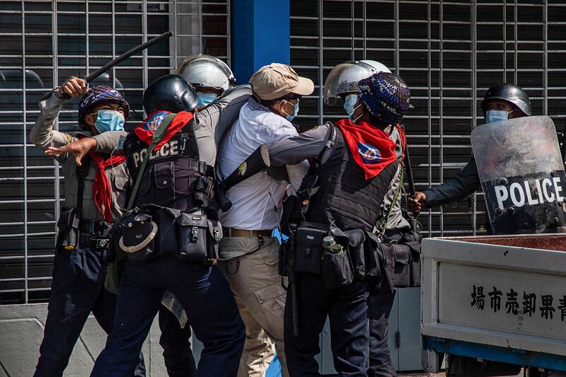 Police arrest anti-coup protesters on February 27, 2021 in Yangon, Myanmar.