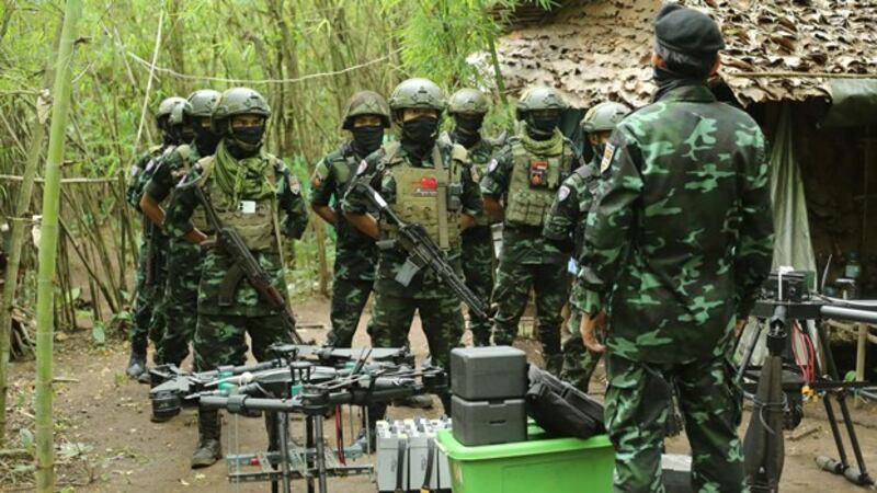 Members of the anti-junta drone militia group Federal Wings listen to instructions from their commander in an undisclosed location in Myanmar, Sept. 4, 2023. Credit: Federal Wings