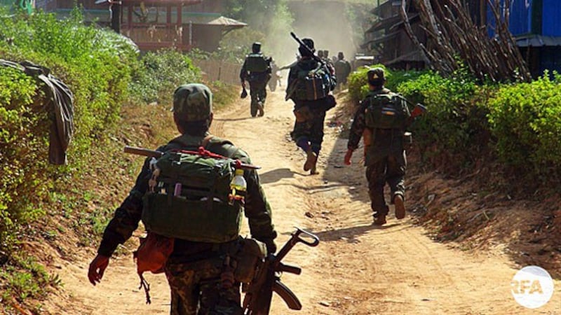 Soldiers from the Restoration Council of Shan State/Shan State Army pass though a village in eastern Myanmar's Shan state in an undated photo.