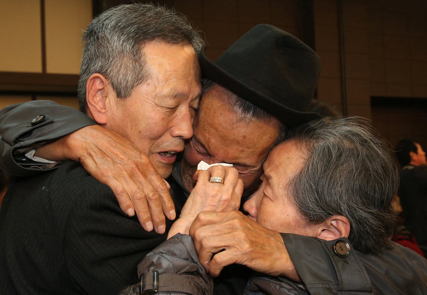 North Korean Son Gwon-Geun (C) cries with his South Korean relatives as they bid farewell following their three-day separated family reunion meeting at the Mount Kumgang resort on the North's southeastern coast on Oct. 22, 2015.