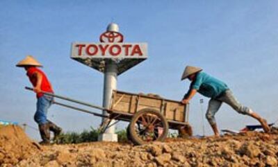 Mất ruộng người nông dân chuyển sang công nhân lao động...AFP