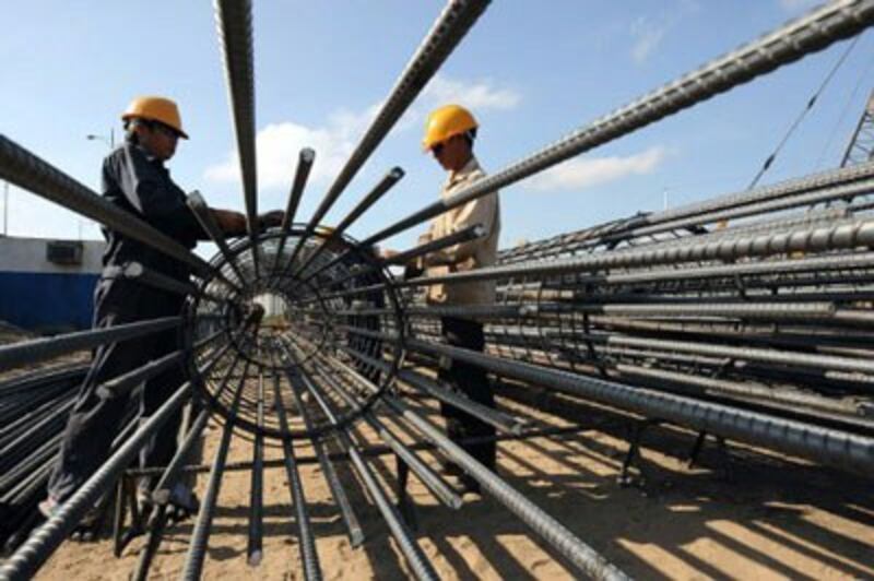 Công nhân xây dựng tại TPHCM, ảnh chụp trước đây. AFP PHOTO.