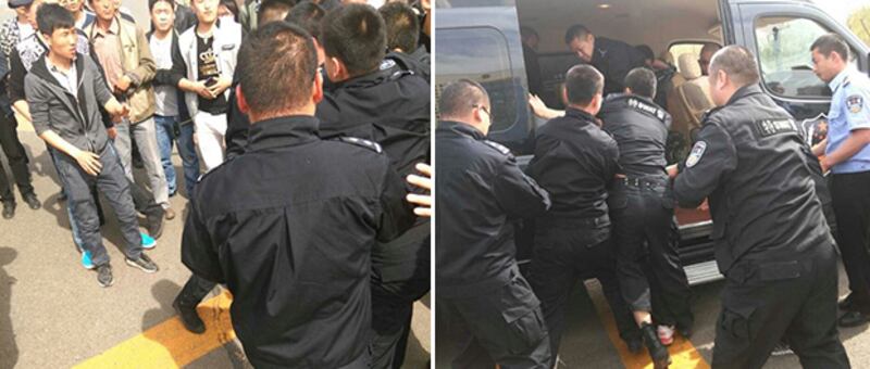 2015年4月27日,政府派出上百保安及警察驅散業主。有情緒激動的業主與對方發生肢體衝突,有四名業主被警方抬上警車送走。(業主攝)