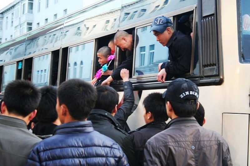 In a file photo, North Korean youths enlisting in the People's Army board the enlistment train. Credit: Yonhap News