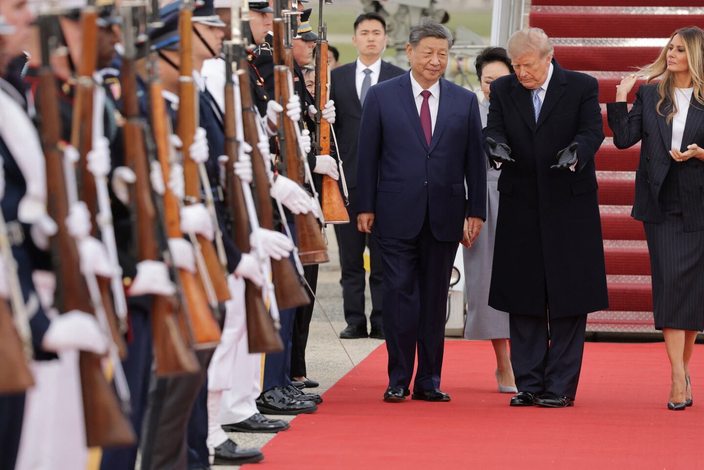 U.S. President Donald Trump shows the way to Chinese President Xi Jinping as he arrives ahead of a state visit at Joint Base Andrews, Sept. 23, 2026.