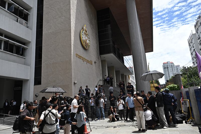 Defense lawyers speak to reporters at the Southern Criminal Court in Bangkok, June 11, 2026, after the verdict in the Erawan Shrine bombing.