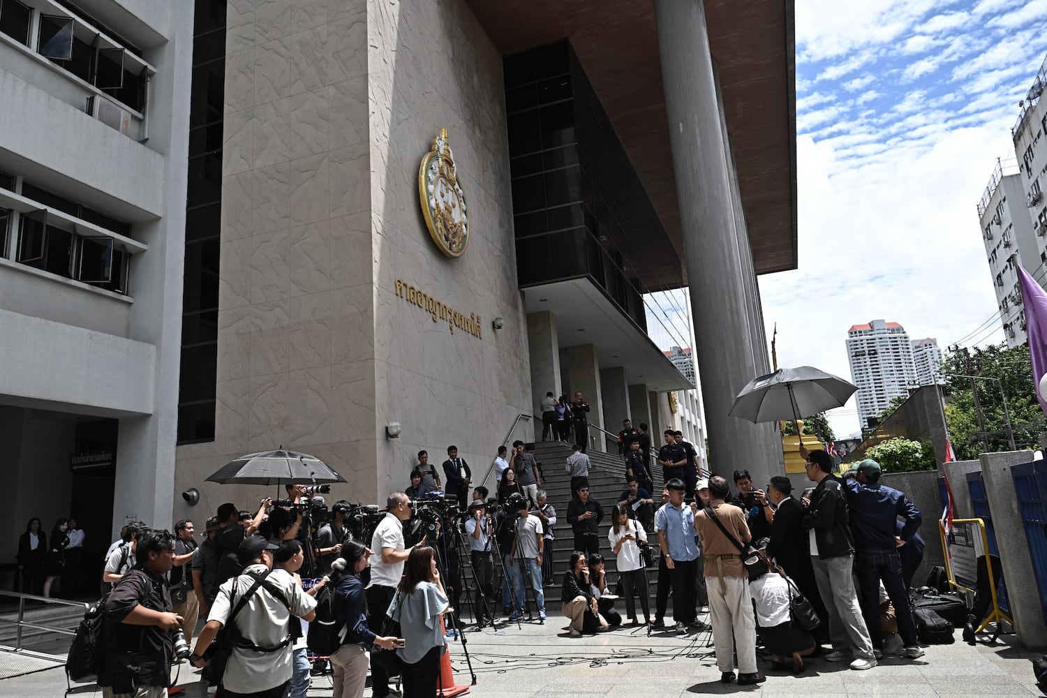 Defense lawyers speak to reporters at Bangkok South Criminal Court,  June 11, 2026, after the verdict for the Erawan Shrine bombing.