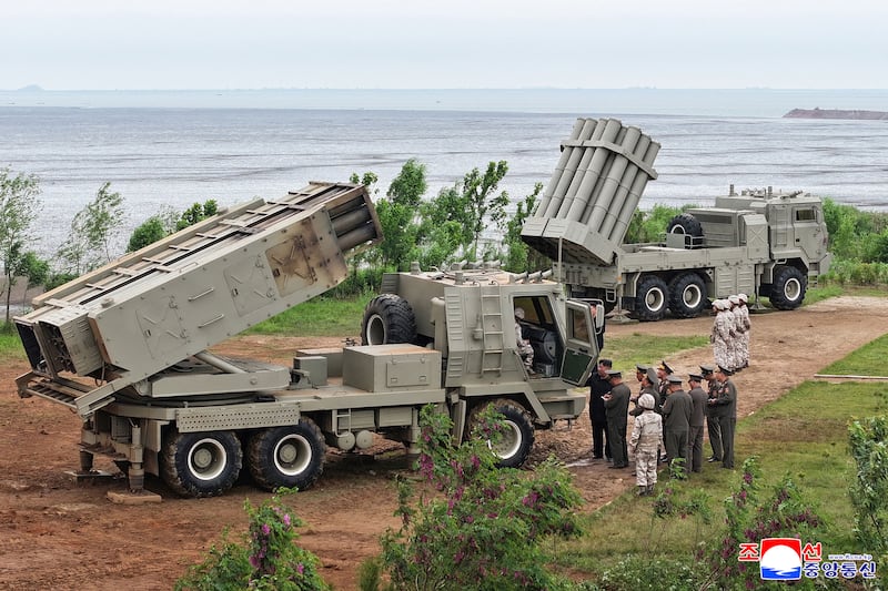 This picture taken on May 26, 2026 and released by North Korea's official Korean Central News Agency (KCNA) on May 27, 2026 shows North Korean leader Kim Jong Un inspecting tests of a newly-developed lightweight multi-purpose missile launching system and a multiple tactical cruise missile weapon system conducted by the Missile Administration and the Academy of Defense Sciences at an undisclosed location in North Korea.