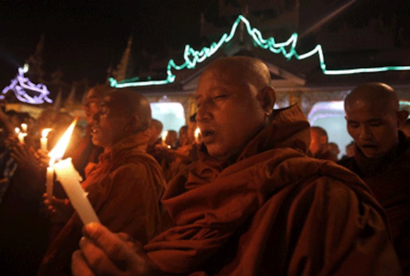 Buddhist monks pray for the Rakhine victims of violence at Shwedagon pagoda in Rangoon, Oct. 30, 2012.
