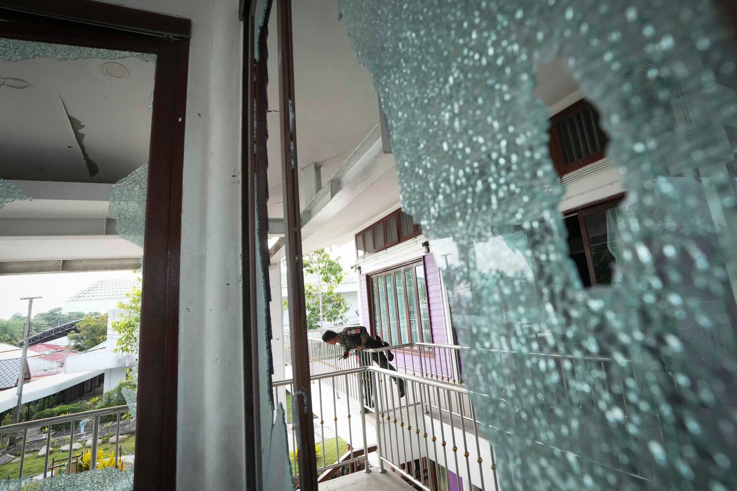 A Thai soldier stands at the Phanom Dong Rak hospital damaged by artillery shells during clashes with Cambodia in Surin Province, Thailand, July 25, 2025. 