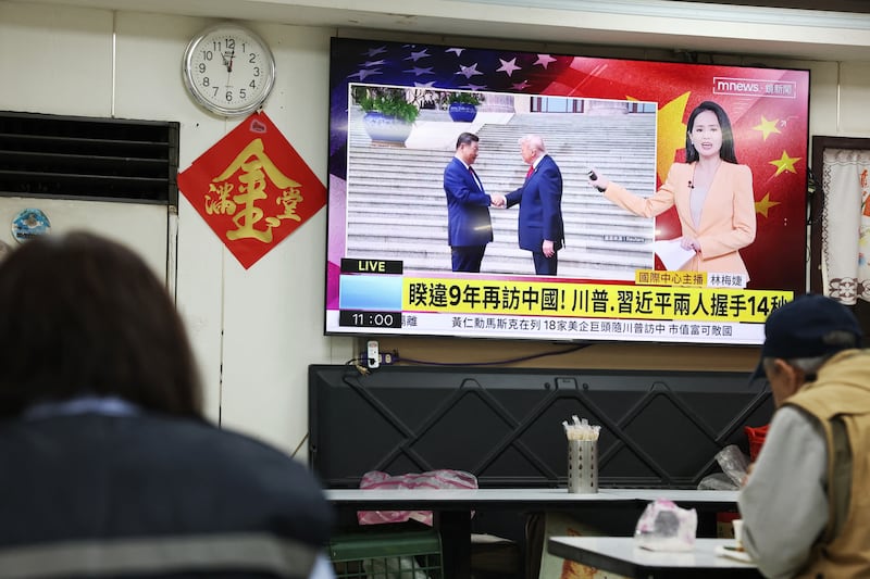 A restaurant in Taipei on May 14, 2026 shows the meeting between the US President Donald Trump and China's President Xi Jinping in Beijing.