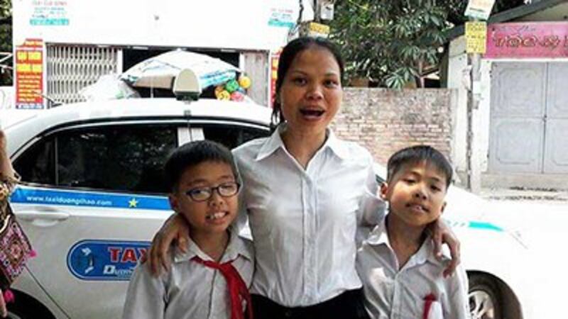 Nguyen Thi Minh Thuy with her two sons after being released from prison, May 5, 2017.