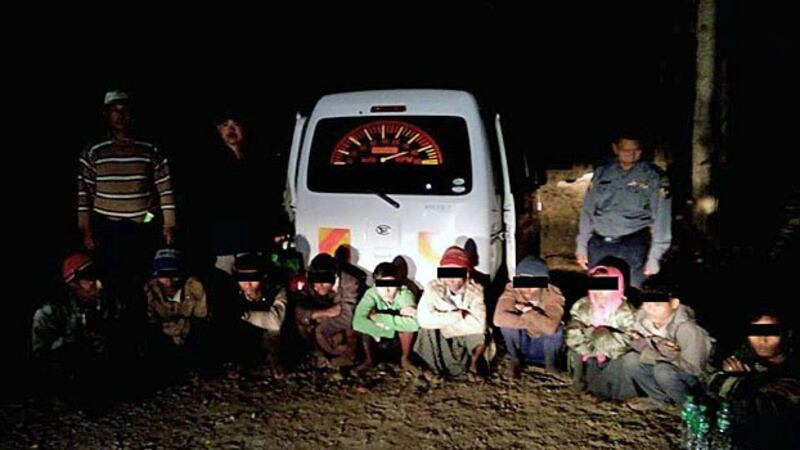 Police arrest 10 Rohingya Muslims from Rakhine state traveling illegally with two human traffickers in the town of Thayetin in Mindon township, central Myanmar's Magway region, Feb. 4, 2019.
