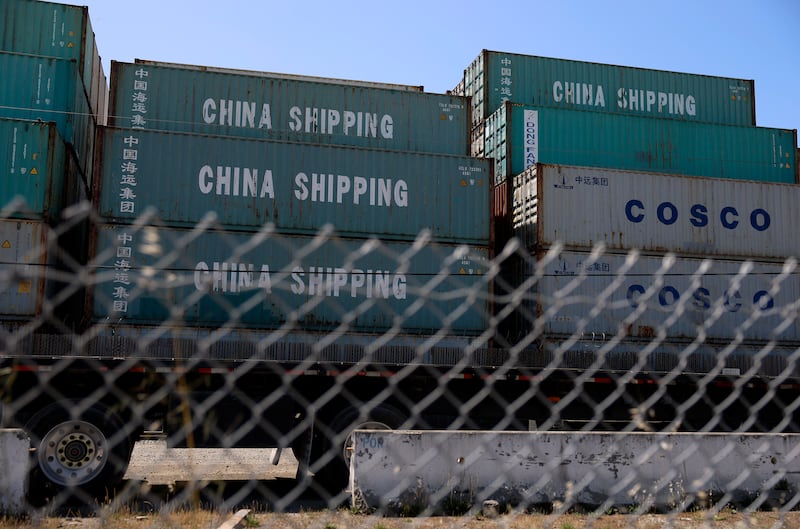 Shipping containers are stacked on a dock at the Port of Oakland on April 28, 2025 in Oakland, California.