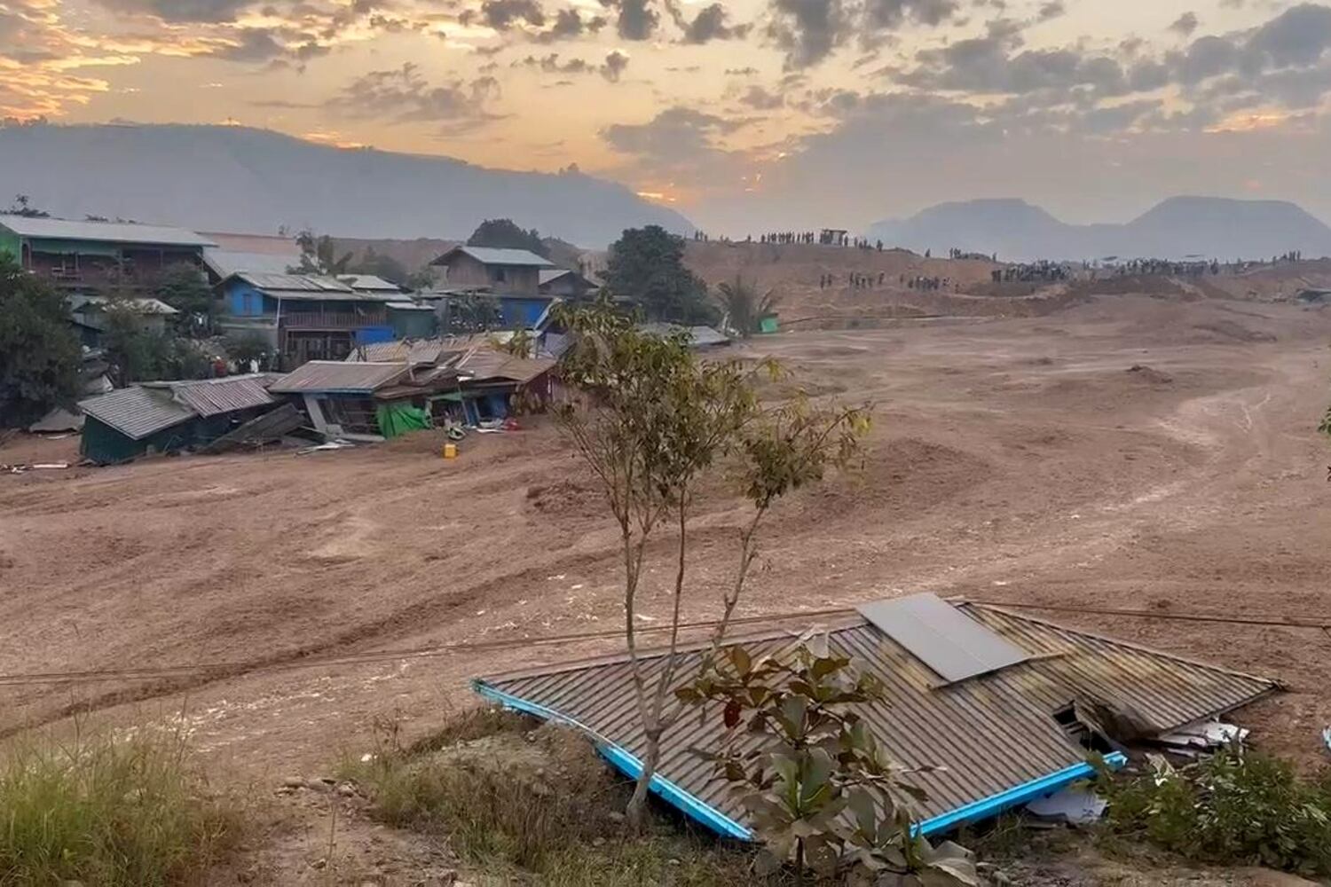 Dozens missing in mudslide at Myanmar jade mine