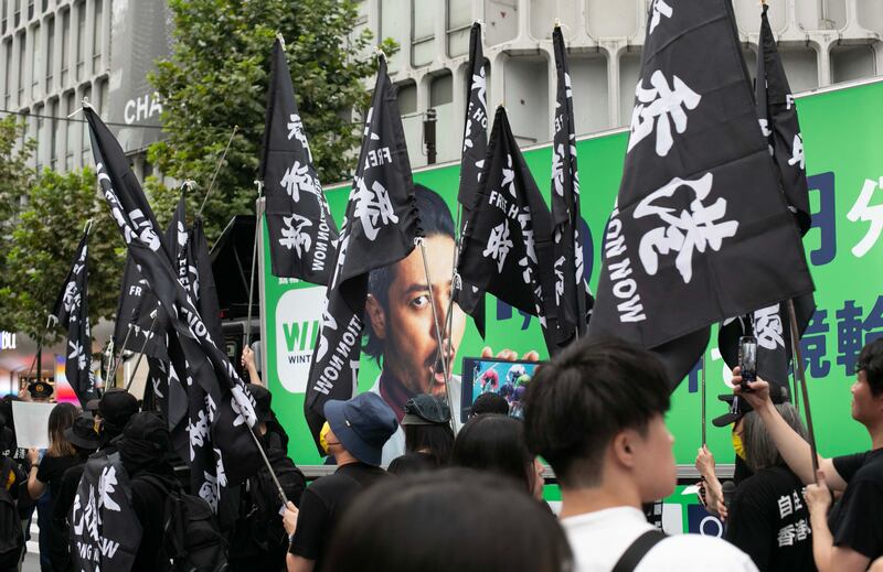 過去「十一」中國國慶，居日中國僑生與香港聯合辦反共示威遊行。（張仕仁攝）