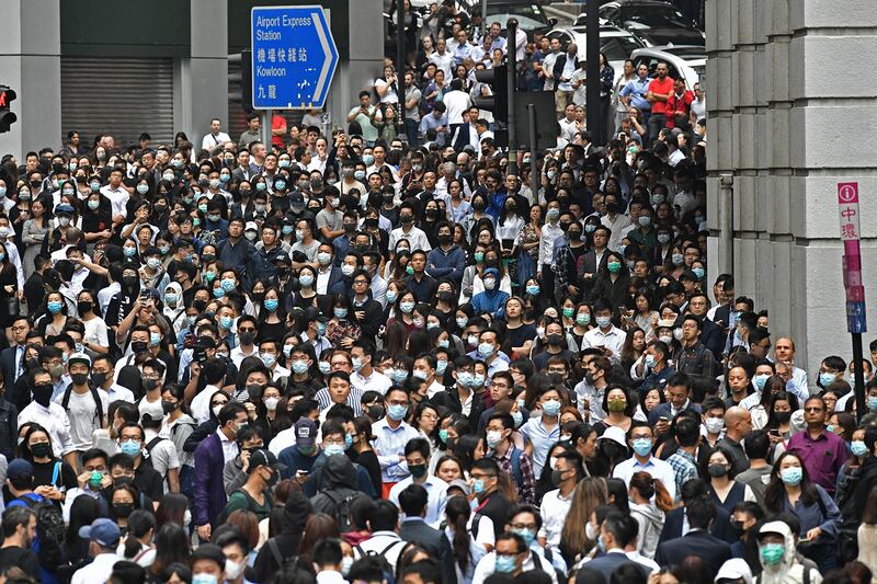 Office workers join pro-democracy protesters during a demonstration in Central in Hong Kong, Nov. 12, 2019 following a day of pro-democracy protests.