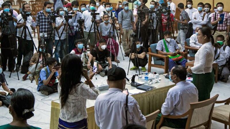 Aye Min Moe (R), the spokeswoman for Myanmar's Union Solidarity and Development Party in Yangon region, addresses reporters during a press conference in Yangon, Nov. 11, 2020.