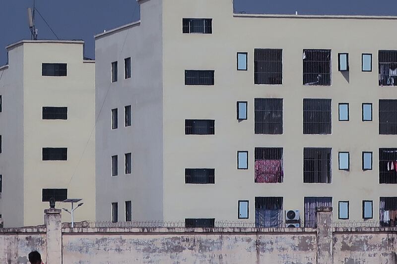This image released by Amnesty International on June 26, 2025, as part of a report on scam centers in Cambodia shows “caged windows and barbed or razor wire on internal walls of a scamming compound.”