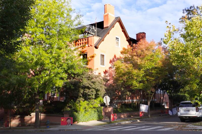 Signs of Chinese President Xi Jinping are seen posted along the street outside the residence of China’s ambassador to the United States in Washington, D.C., Oct. 2024.