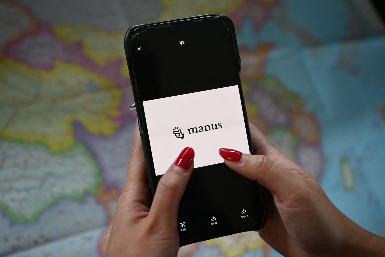 The Manus logo on a mobile phone in Beijing on April 28, 2026.