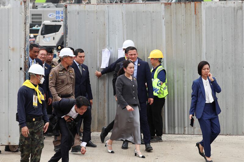 Thailand's Prime Minister Paetongtarn Shinawatra visits the site of a building that collapsed, following a strong earthquake, in Bangkok, Thailand, March 31, 2025. REUTERS/Chalinee Thirasupa