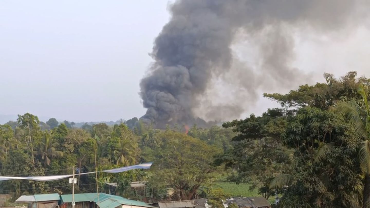 This screengrab from a video shows smoke in the distance from a fire at a Rohingya settlement in a no-man’s land between Bangladesh and Myanma