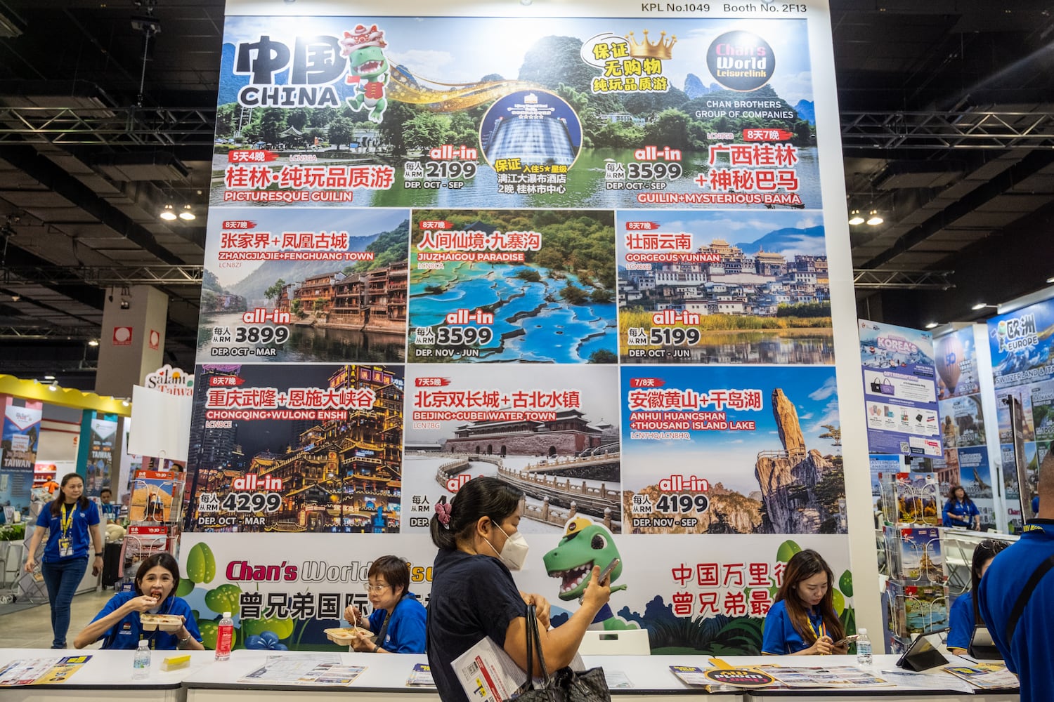 A travel agency booth displays a huge sign showing Chinese tourist destinations during the Matta Fair 2024 in Kuala Lumpur, Sept. 6, 2024. (S. Mahfuz/BenarNews)