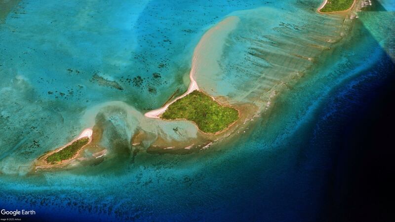 The tiny island of Ngerbelas, center, is seen off the tip of the Palau island chain, May 8, 2023.