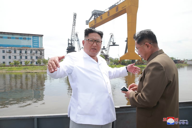 North Korean leader Kim Jong Un gives field guidance during his visit to the Chongjin Shipyard in this undated photo released by North Korea's Korean Central News Agency (KCNA) in Pyongyang July 17, 2018.