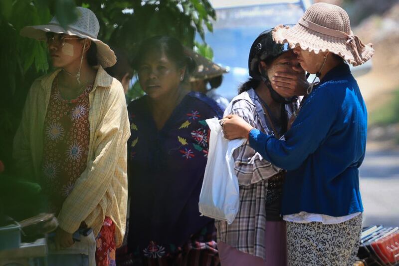 Family members grieve as they collect the belongings of children killed at a pre-school in Sagaing city, Myanmar, on April 24, 2025, four weeks after Myanmar's devastating earthquake.