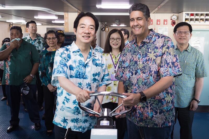 Taiwan President Lai Ching-te, left, poses with Palau's President Surangel Whipps Jr. aboard the Taiwan Coast Guard patrol ship “Yunlin” at the Port of Malakal in the state of Koror, Palau, Dec. 6, 2024.