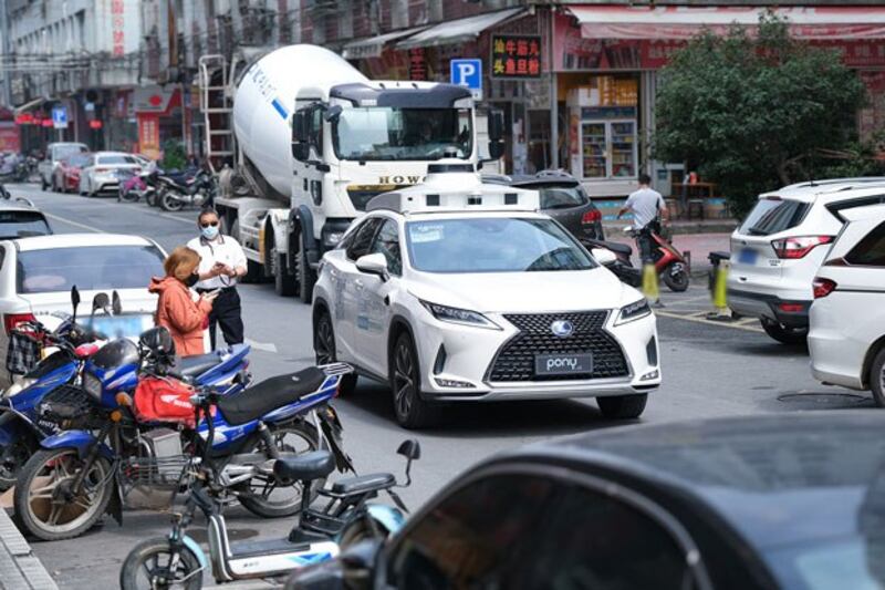 A Pony.ai robotaxi makes its way down the street in Nansha, China, in an undated photo. (Business Wire)