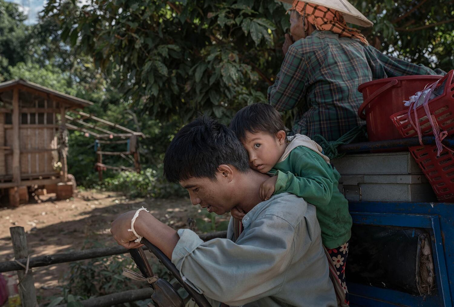 A child cries as her father and other civilians prepare to flee Phuk Khe village in southern Shan state, Myanmar, Oct. 30, 2024.