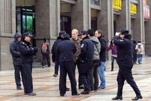 Police surround foreign journalists at a Beijing shopping center designated as a protest site by online groups, Feb. 27, 2011.