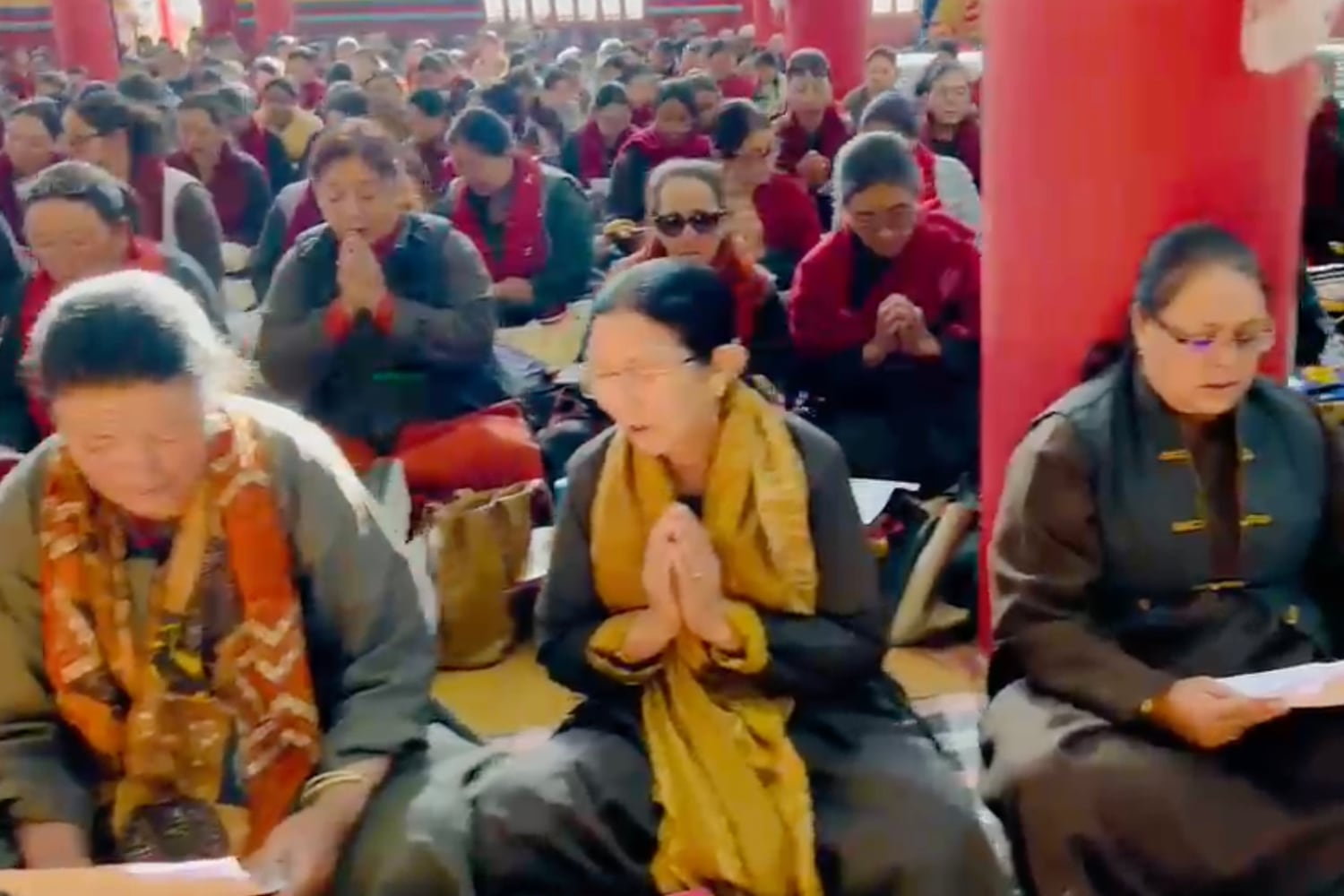 Residents pray for the successful knee surgery of the Dalai Lama at the Dharma Centre on June 8, 2026 in Ladakh, India.