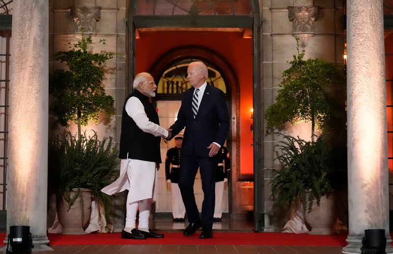 President Joe Biden talks with India's Prime Minister Narendra Modi as he leaves the Quad leaders summit in Claymont, Del., Sept. 21, 2024.