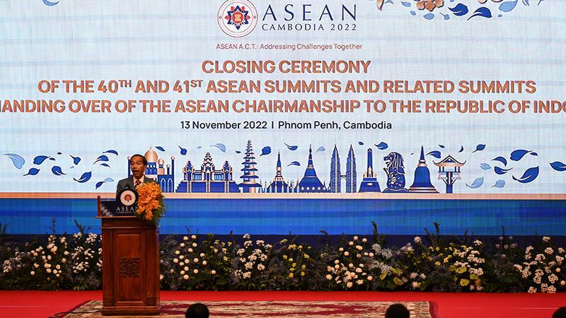 Hun Sen, left, hands over the gavel to Indonesian President Joko Widodo during a transfer of ASEAN Chairmanship during the closing ceremonies of the 40th and 41st ASEAN Summit in Phnom Penh, Cambodia, Sunday, Nov. 13, 2022 by AFP-3.jpg