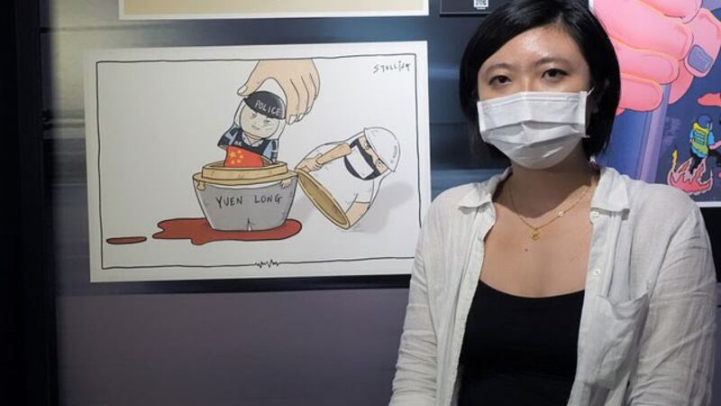 台湾政治漫画家Stellina Chen创作“港版俄罗斯娃娃”。(记者 黄春梅摄)