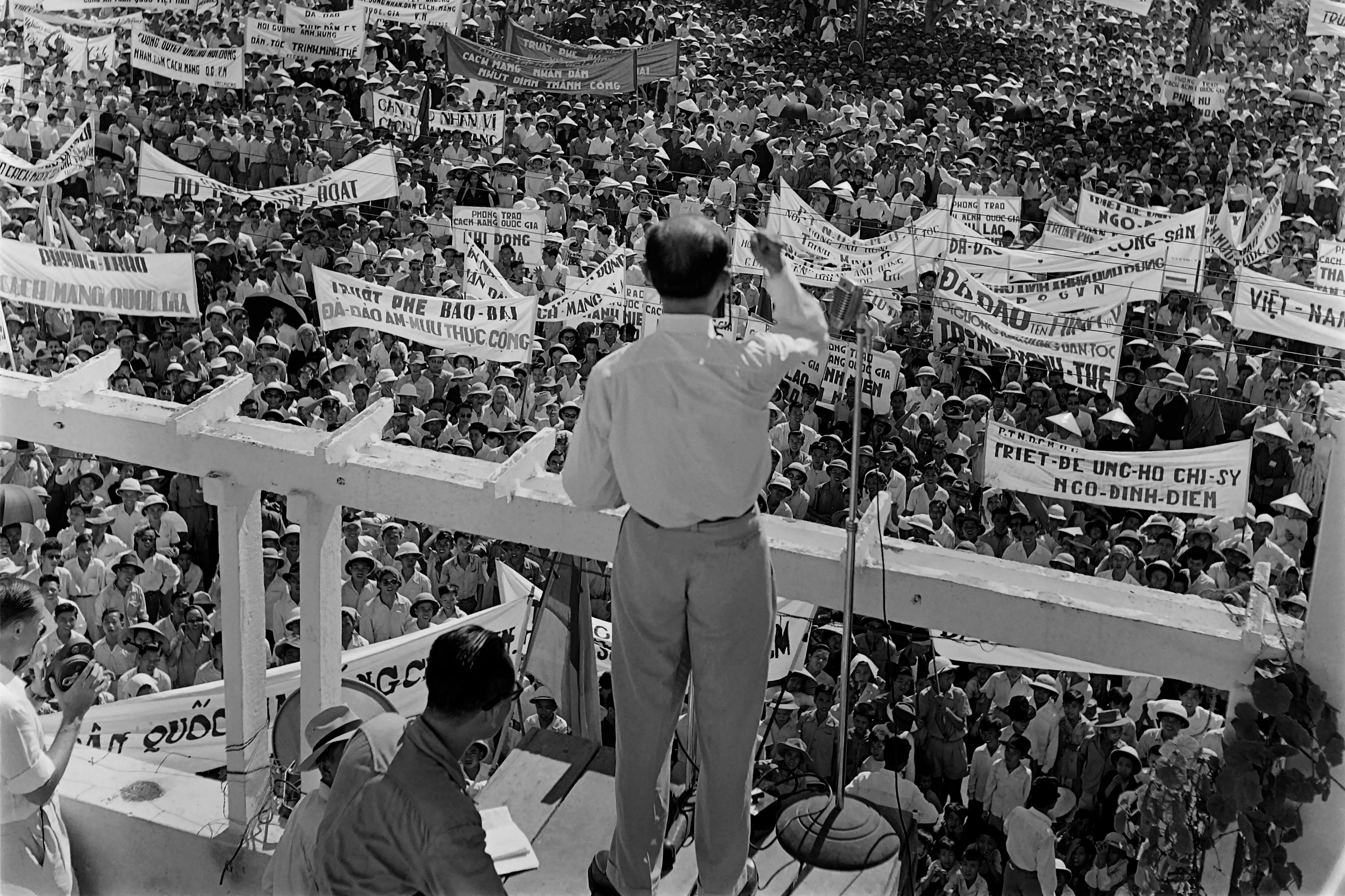 Picture released on May 18, 1955 of members of the National Assembly of Vietnam addressing the crowd during a demonstration in Saigon against Emperor Bao Dai and in support of Prime minister Ngo Dinh Diem, during the Vietnam War. (Photo by Fernand GIGON / INTERCONTINENTALE / AFP)