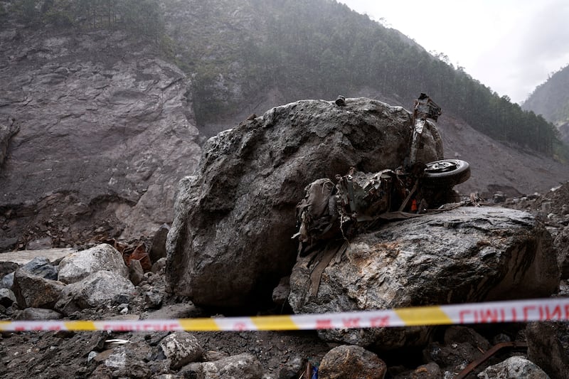 Tape cordons off an area near a damaged vehicle at the core disaster-hit area at Kyirong (Gyirong) Port during an organized media tour in Shigatse, Tibet, Sept. 6, 2026.